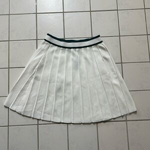 Super cute Cider white miniskirt with green accents. Brand new. Size small.